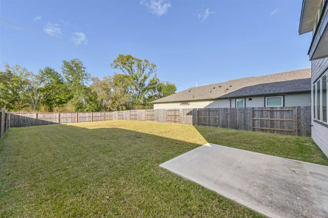 a view of backyard with green space