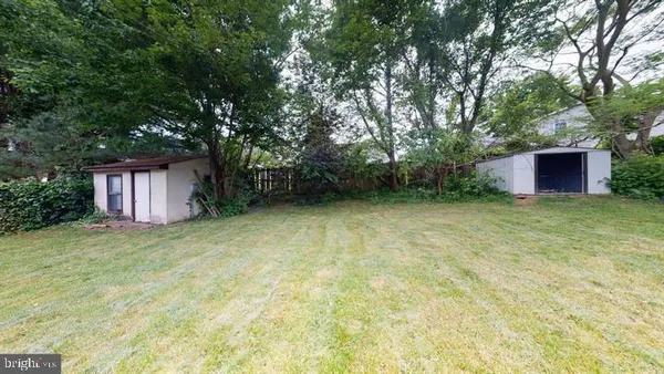 a view of a house with pool and chairs