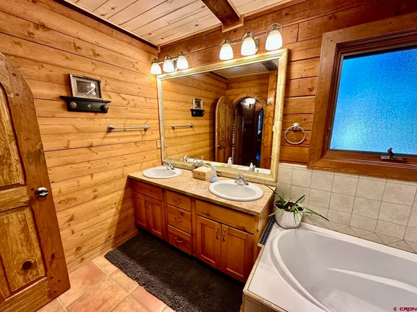 a bathroom with a tub and shower