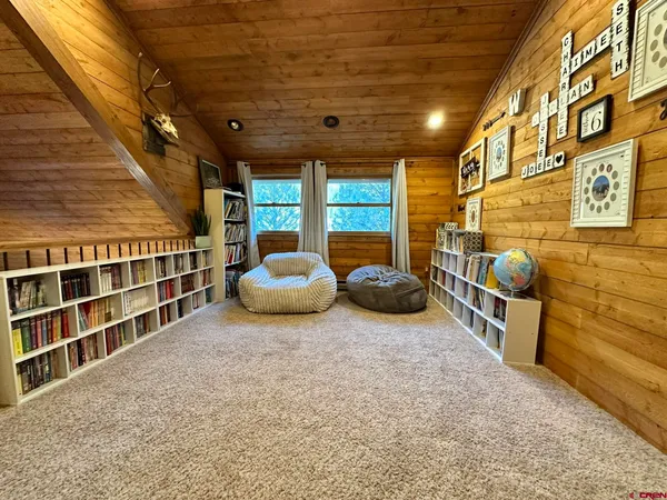 a bed room with a bed and a desk