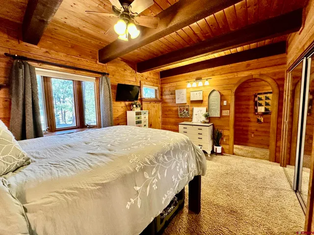 a bathroom with a double vanity sink mirror and bathtub