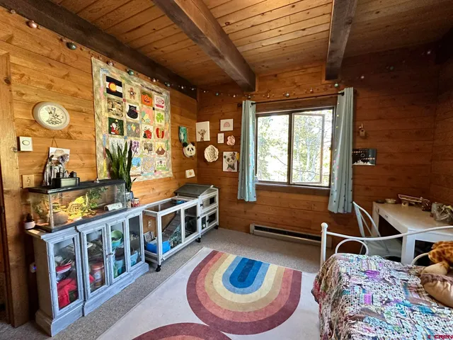 a bathroom with a granite countertop toilet a sink and a shower