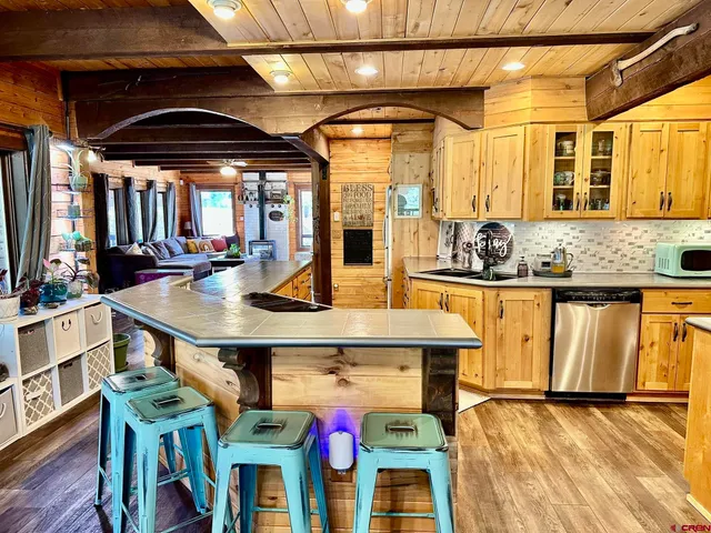 a kitchen with a stove and a white cabinets