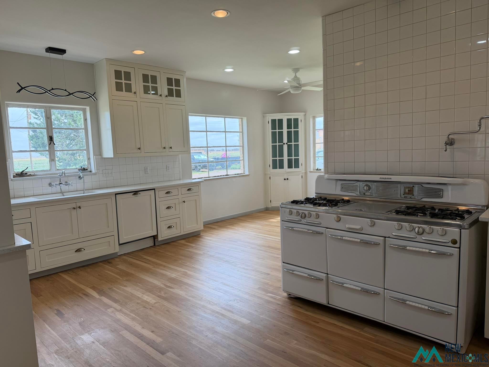 570 Curry Road North Clovis, NM 88101 - Photo 2 of 59 Spacious kitchen featuring wood-finish flooring and a vintage-style range