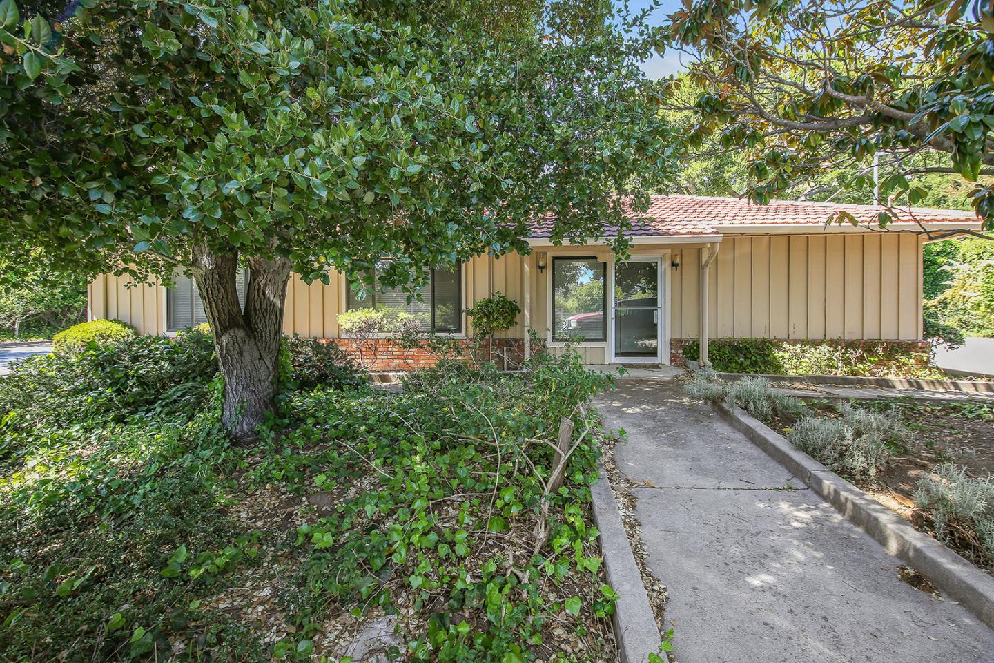 1513 Folger Drive Belmont, CA 94002 - Photo 3 of 18 a front view of a house with garden