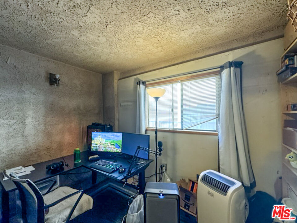 12511 Culver Boulevard Los Angeles, CA 90066 - Photo 11 of 26 a living room with furniture and a window