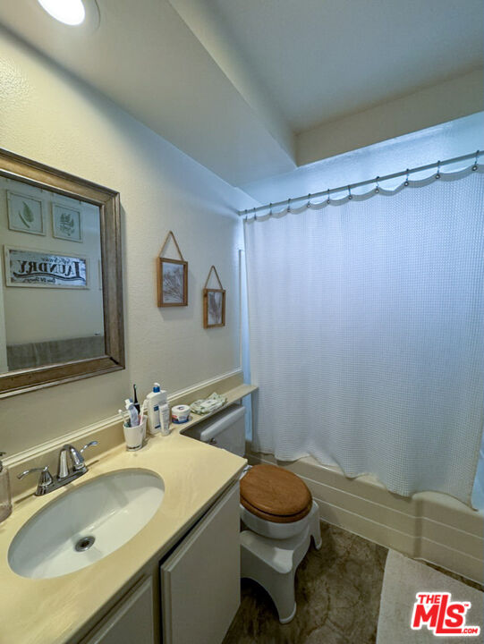 12511 Culver Boulevard Los Angeles, CA 90066 - Photo 23 of 26 a bathroom with a sink toilet and shower