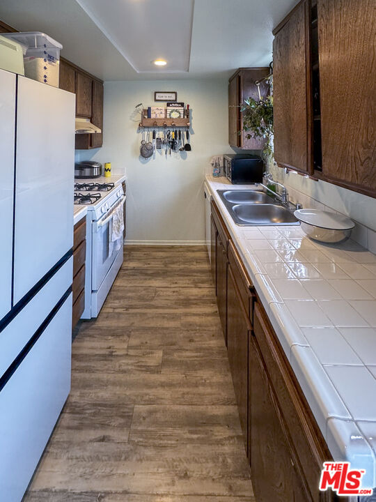 12511 Culver Boulevard Los Angeles, CA 90066 - Photo 26 of 26 a kitchen with stainless steel appliances granite countertop a sink and a stove
