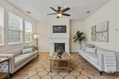 a living room with furniture and a fireplace