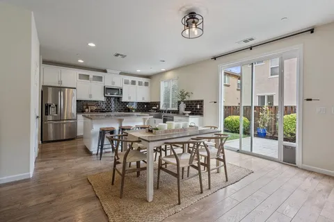 a view of a dining room with furniture window and outside view
