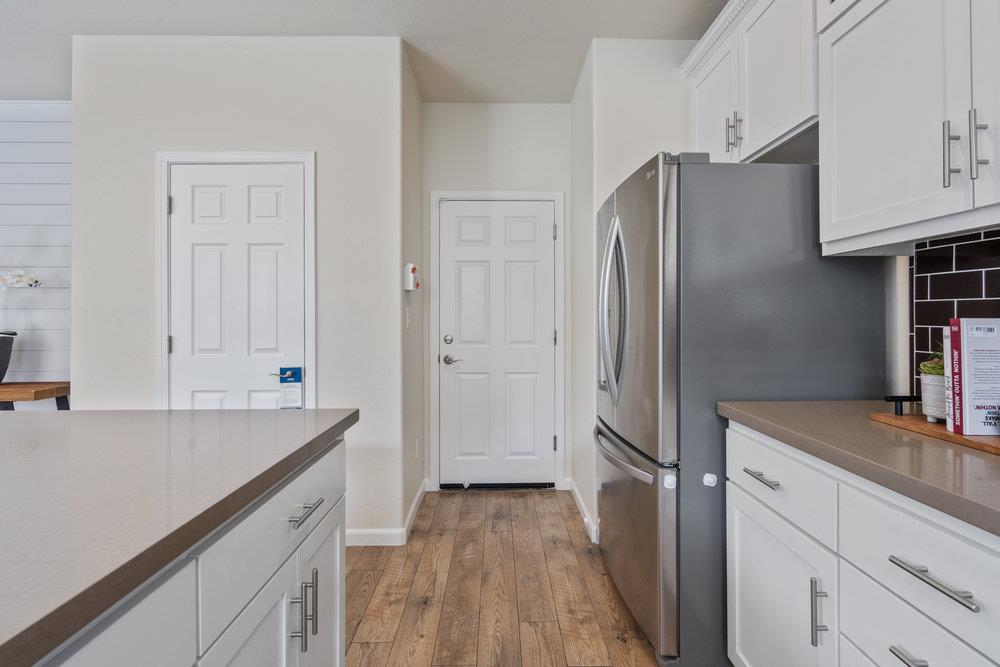 130 Lusitano Way Gilroy, CA 95020 - Photo 18 of 50 a kitchen with a refrigerator and a sink