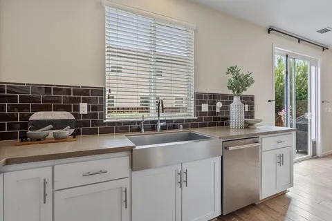 a living room with fireplace furniture and a wooden floor