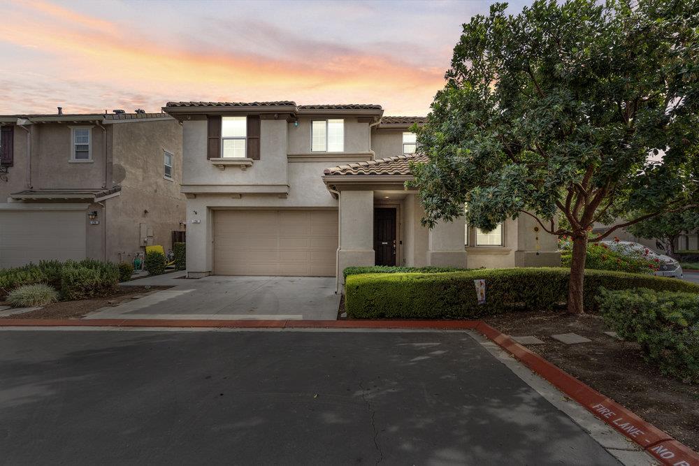 130 Lusitano Way Gilroy, CA 95020 - Photo 2 of 50 a front view of a house with a yard and a garage