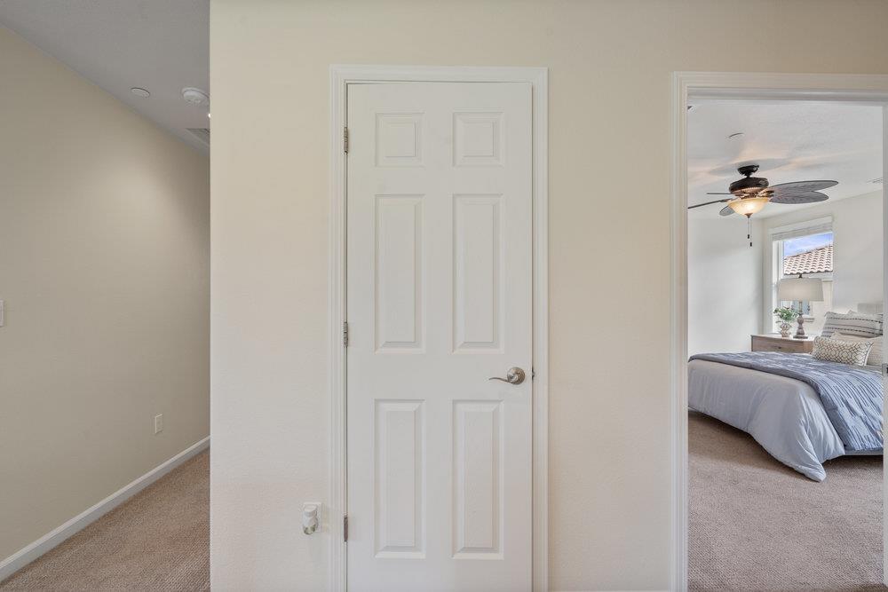 130 Lusitano Way Gilroy, CA 95020 - Photo 22 of 50 a view of a bedroom with a bed and a mirror