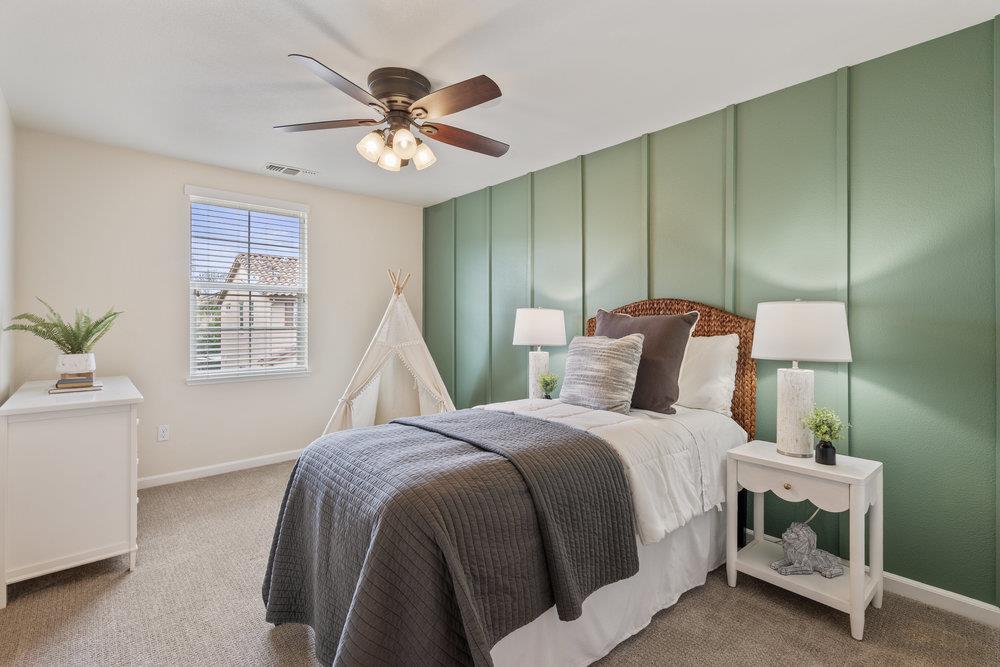 130 Lusitano Way Gilroy, CA 95020 - Photo 34 of 50 a bed room with a bed and a ceiling fan