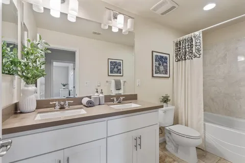 a view of a patio with table and chairs and potted plants
