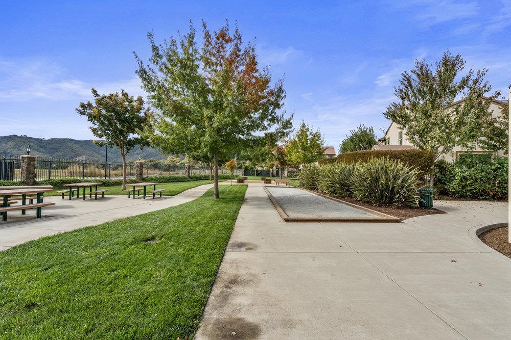 130 Lusitano Way Gilroy, CA 95020 - Photo 49 of 50 a view of swimming pool outdoor seating and trees in the background