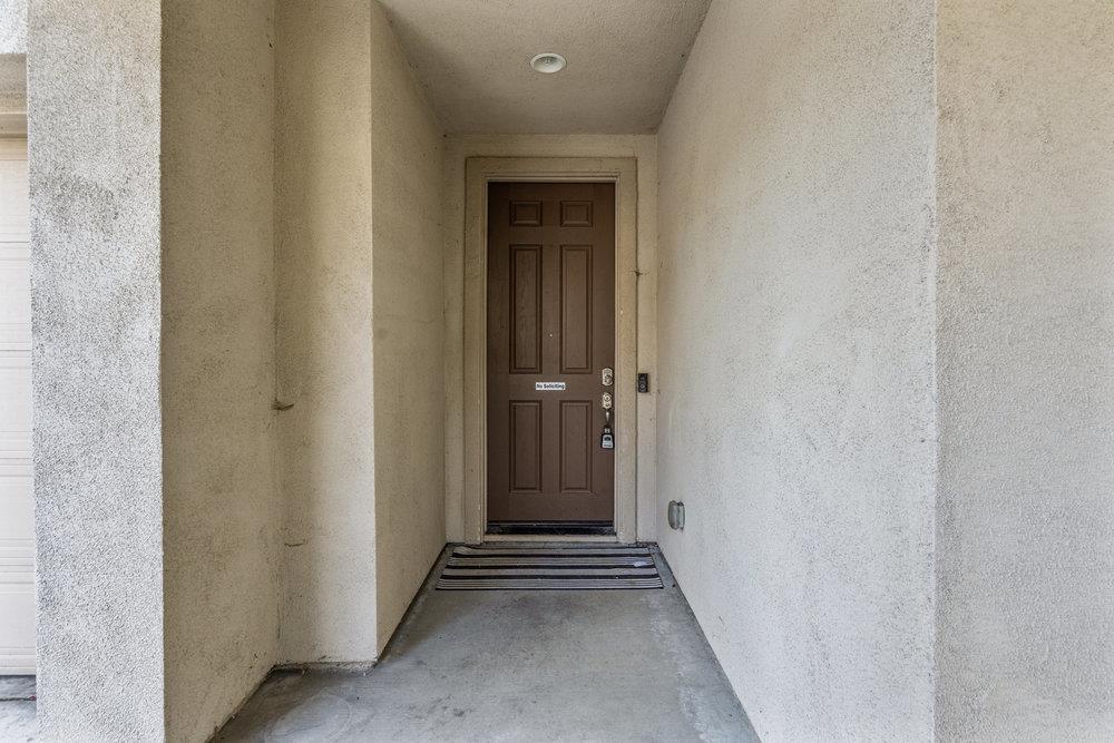 130 Lusitano Way Gilroy, CA 95020 - Photo 5 of 50 a view of a hallway with wooden floor