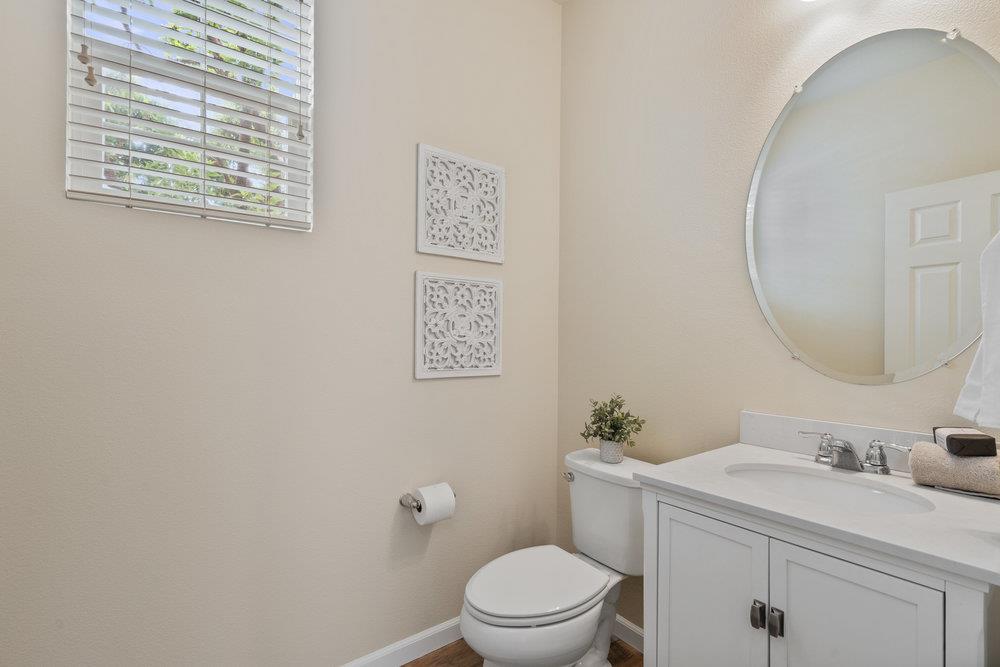 130 Lusitano Way Gilroy, CA 95020 - Photo 9 of 50 a bathroom with a toilet a sink and a mirror