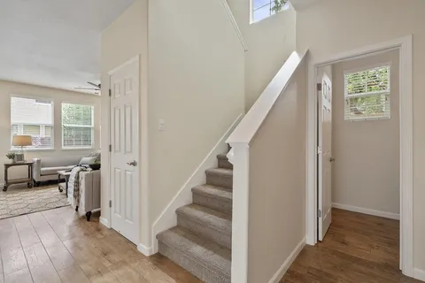 a living room with furniture a fireplace and a table