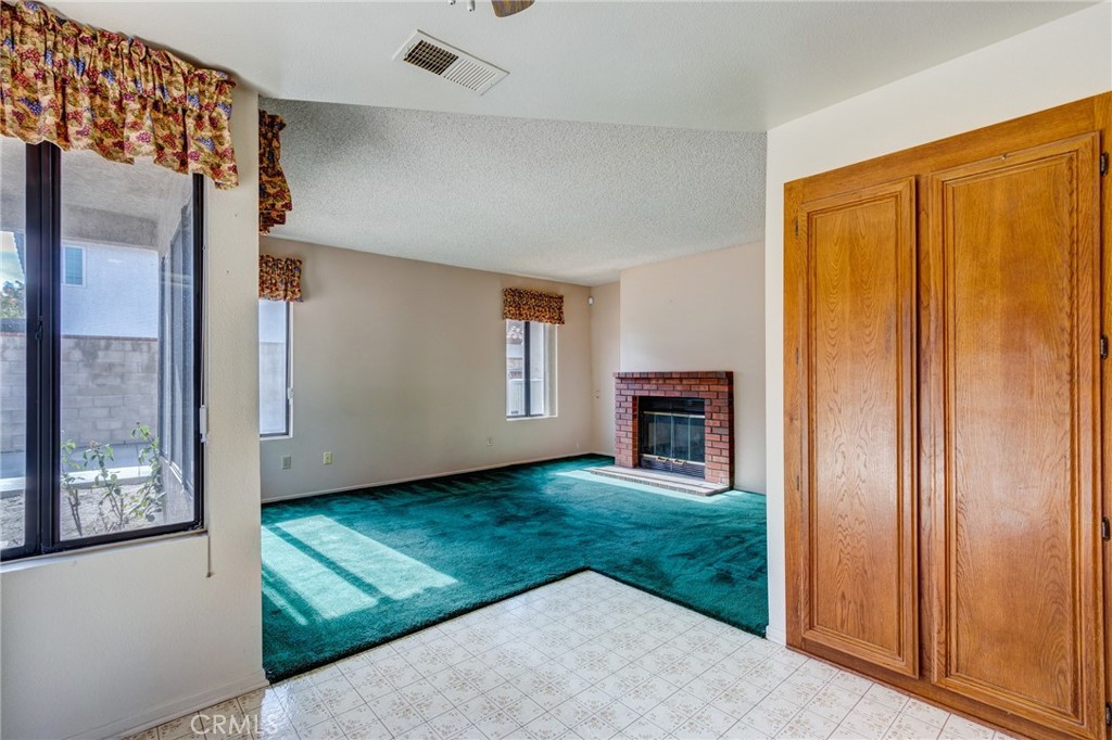 1922 Alta Street Redlands, CA 92374 - Photo 12 of 45 an empty room with windows & cabinet door