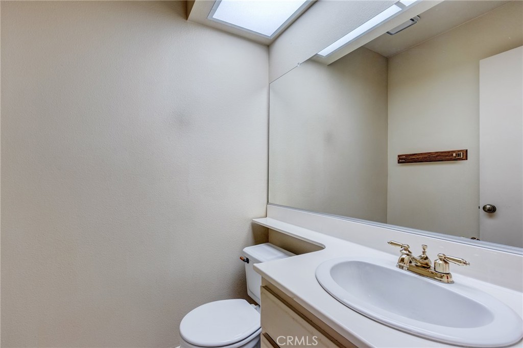 1922 Alta Street Redlands, CA 92374 - Photo 16 of 45 a bathroom with a sink and a toilet