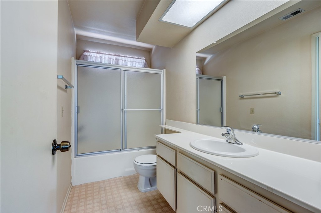 1922 Alta Street Redlands, CA 92374 - Photo 26 of 45 a bathroom with a sink toilet and shower