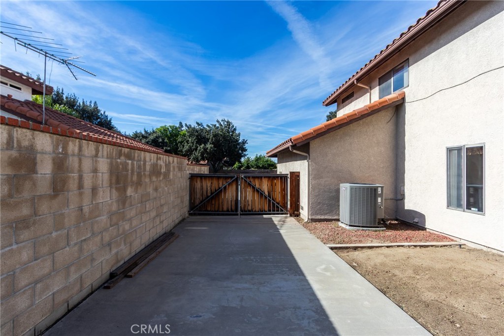 1922 Alta Street Redlands, CA 92374 - Photo 34 of 45 a view of a house with a wooden fence