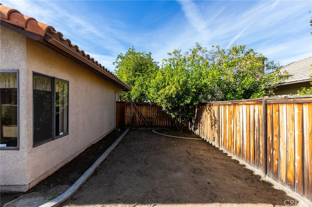 1922 Alta Street Redlands, CA 92374 - Photo 37 of 45 a backyard of a house with lots of green space
