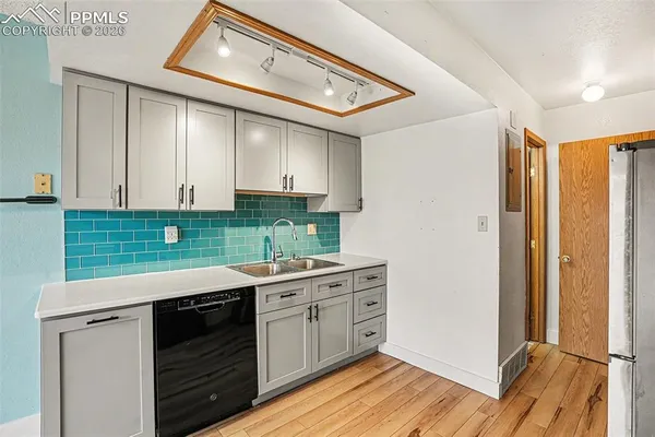 a kitchen with a sink and cabinets