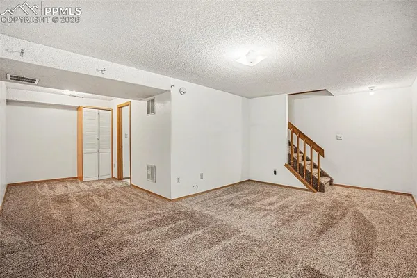 a bathroom with a sink a mirror and a shower