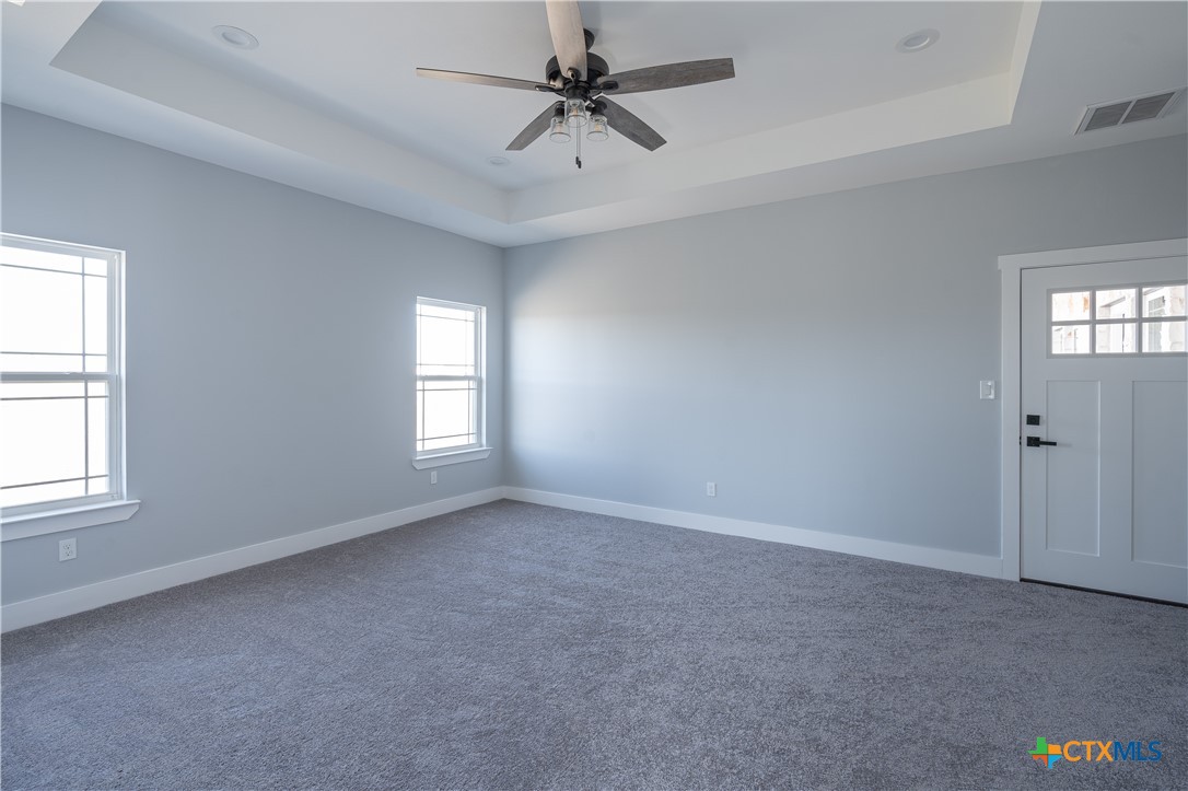 1000 Black Ankle Road Lockhart, TX 78644 - Photo 18 of 40 an empty room with windows and fan