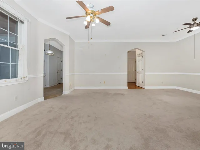 a kitchen with a stove a sink and a refrigerator