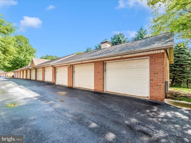 an empty room with windows and entrance
