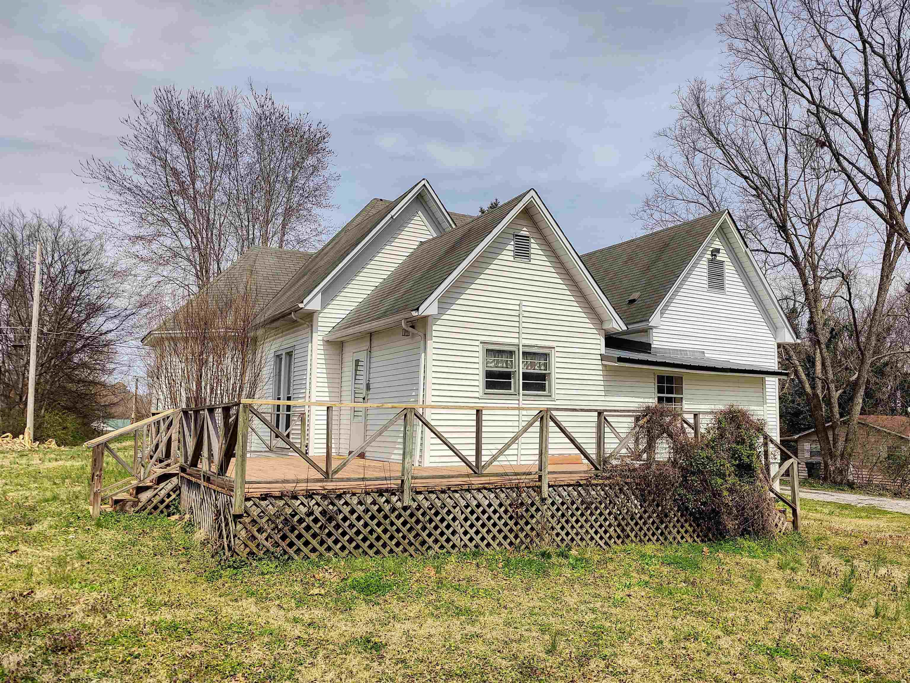 115 Walnut Lane McKenzie, TN 38201 - Photo 15 of 16 a view of a house with a yard patio and a garden