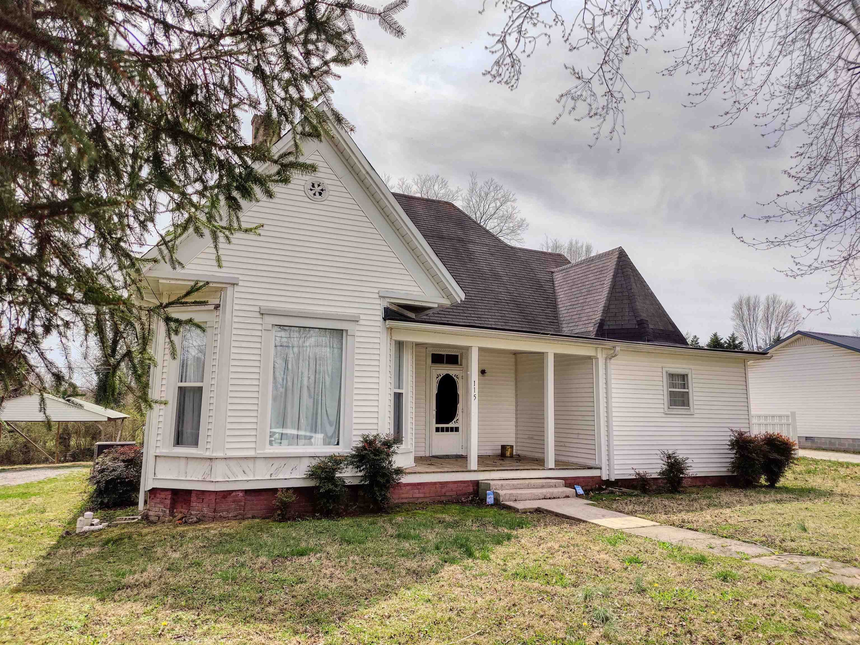115 Walnut Lane McKenzie, TN 38201 - Photo 3 of 16 a front view of a house with a yard