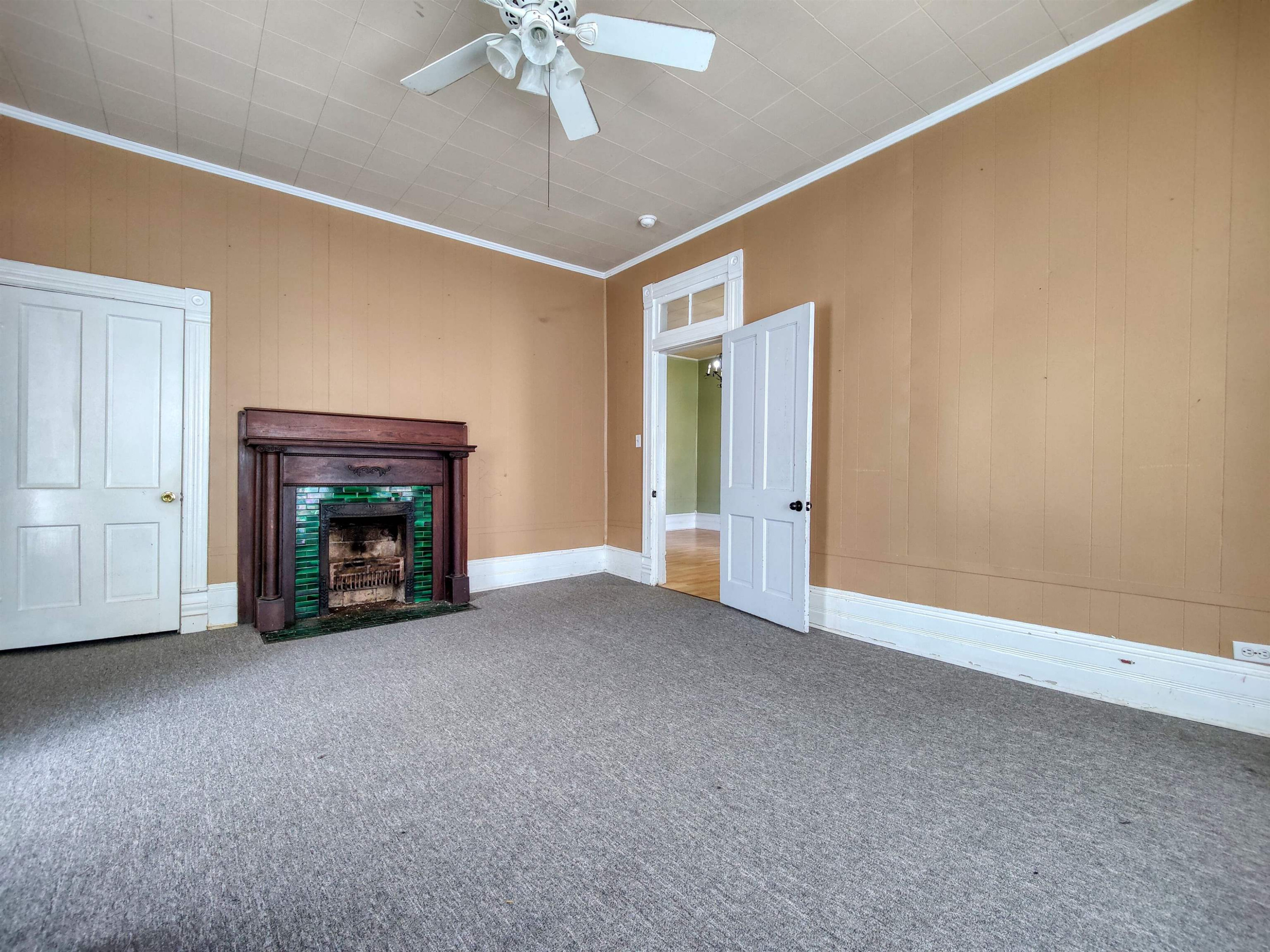 115 Walnut Lane McKenzie, TN 38201 - Photo 6 of 16 a view of an empty room with a fireplace and a window