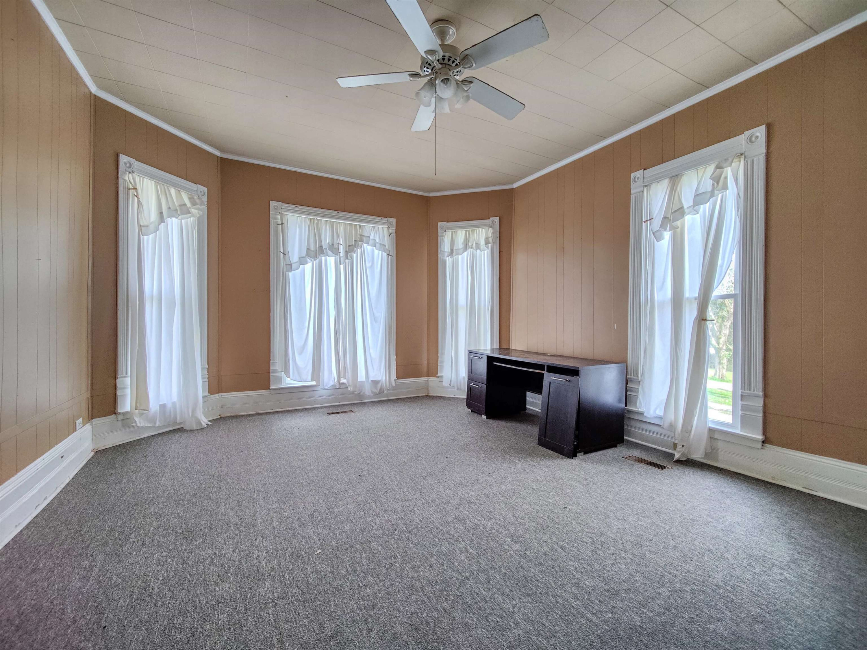 115 Walnut Lane McKenzie, TN 38201 - Photo 7 of 16 an empty room with windows and chandelier fan