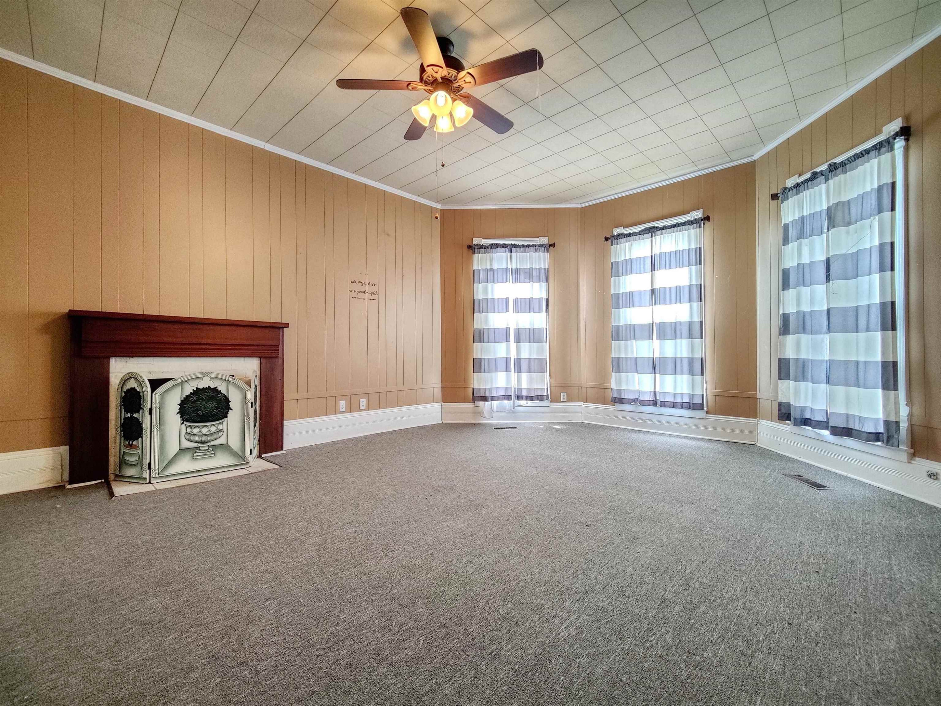 115 Walnut Lane McKenzie, TN 38201 - Photo 8 of 16 a view of an empty room with a fireplace and a window