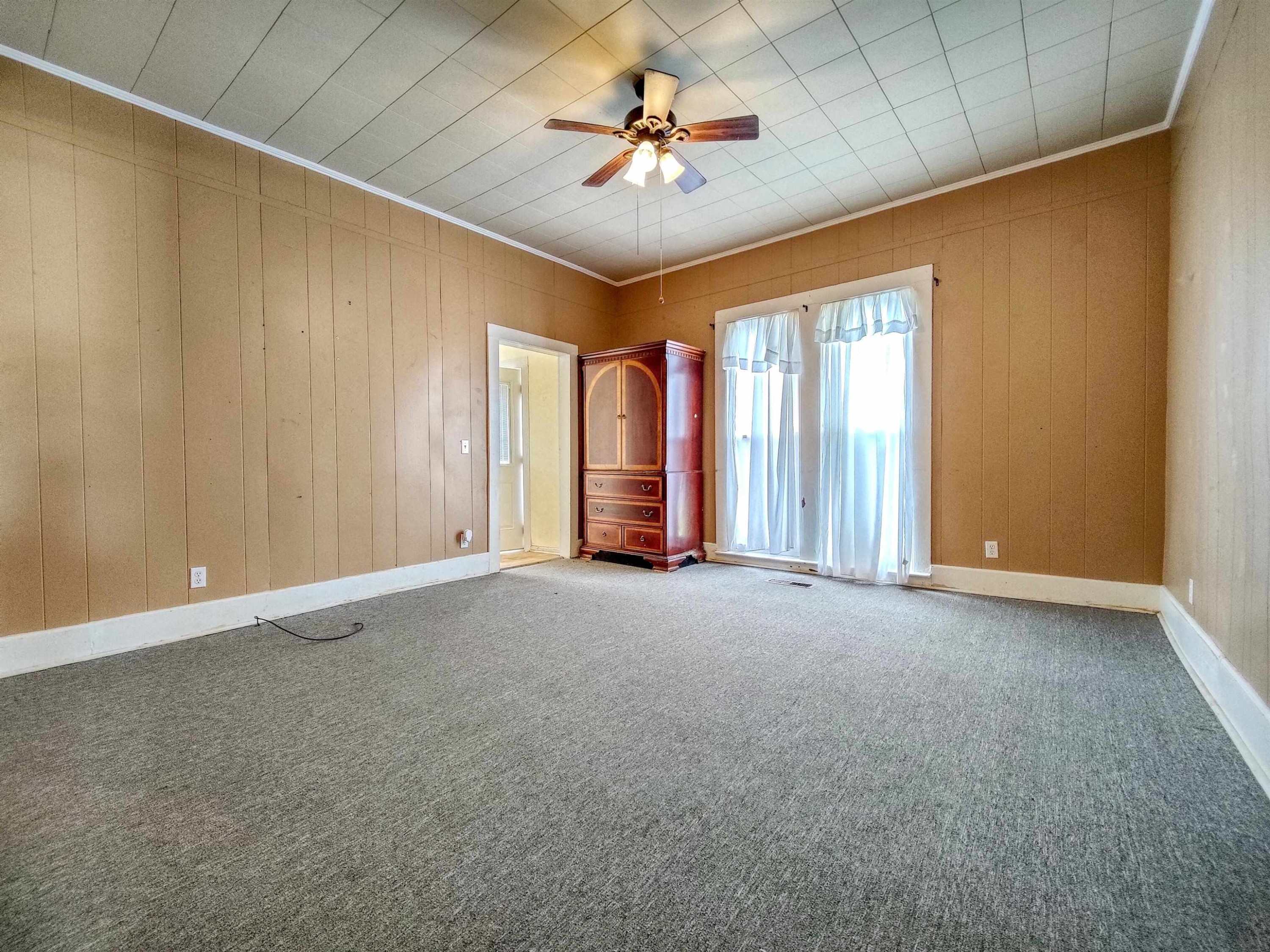 115 Walnut Lane McKenzie, TN 38201 - Photo 10 of 16 a view of n empty room with a ceiling fan and window