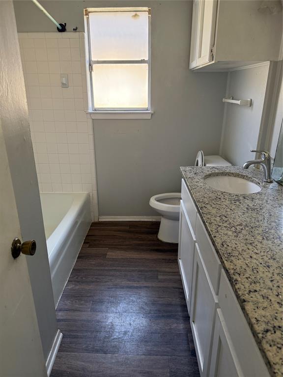 2604 Quail Valley Irving, TX 75060 - Photo 18 of 25 a bathroom with a granite countertop sink and toilet