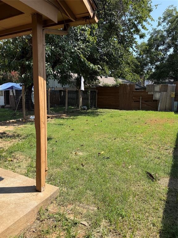 2604 Quail Valley Irving, TX 75060 - Photo 23 of 25 a view of a backyard with large trees and a barn