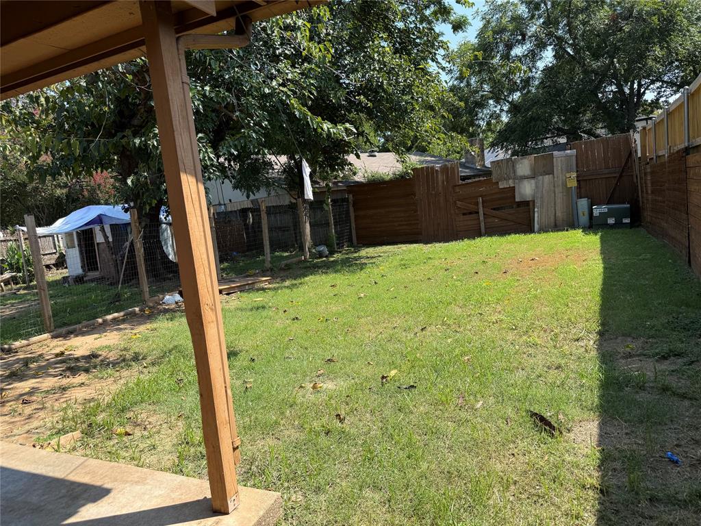 2604 Quail Valley Irving, TX 75060 - Photo 24 of 25 a backyard of a house with wooden floor and fence