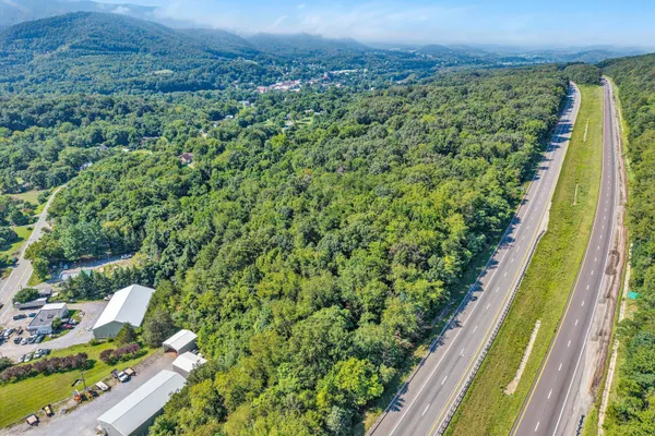a view of a city from a balcony with a garden