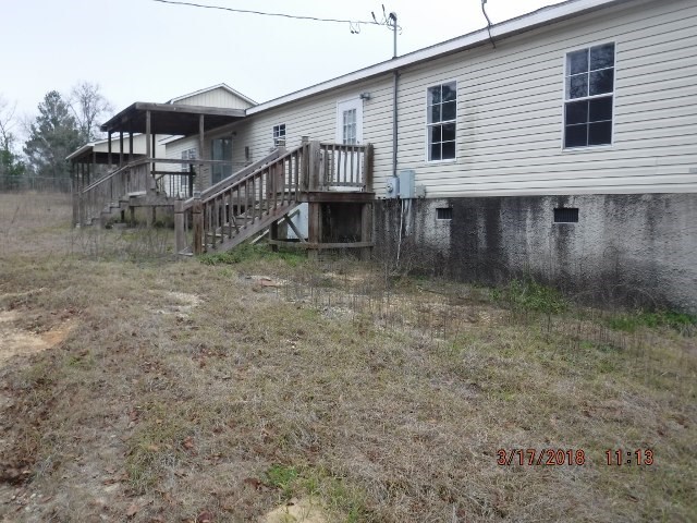 1716 Mathews Road Roberta, GA 31078 - Photo 2 of 3 a view of a house with a yard