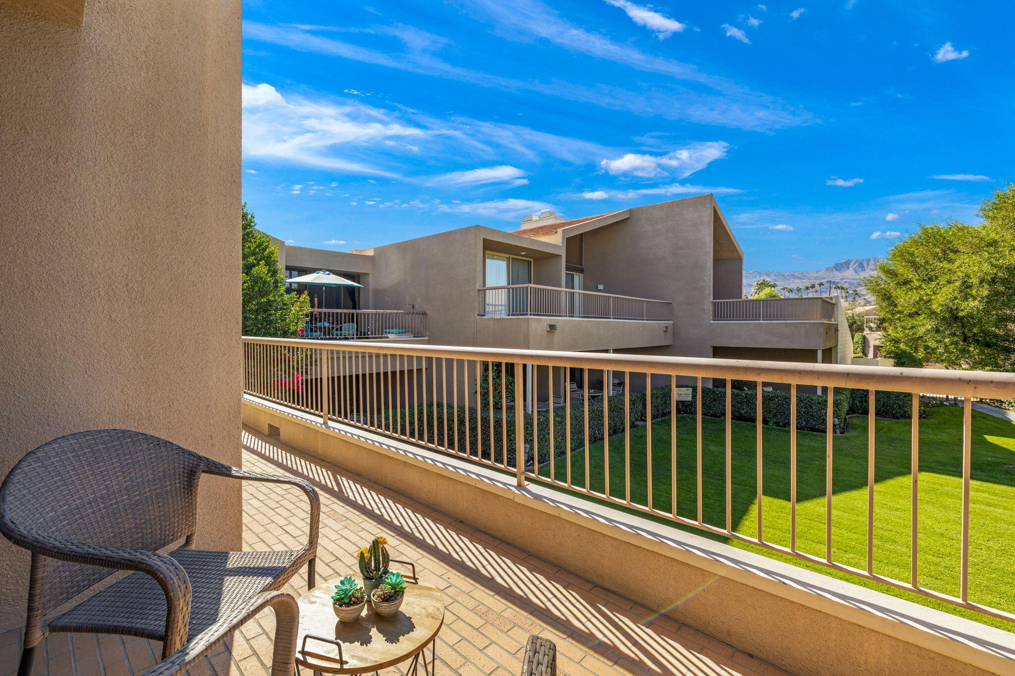 45775 Juniper Circle, Unit 616A Palm Desert, CA 92260 - Photo 15 of 35 a view of a balcony with a potted plant