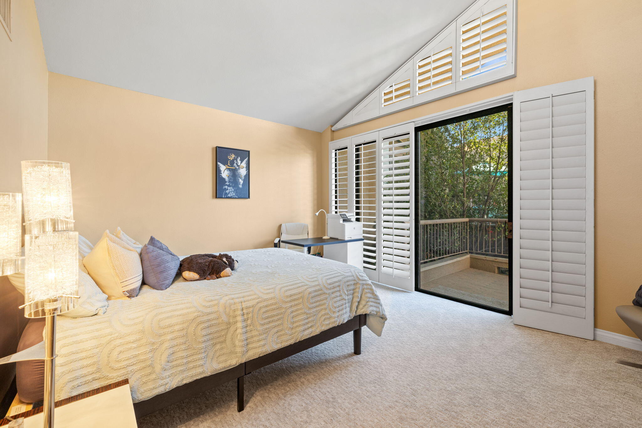 45775 Juniper Circle, Unit 616A Palm Desert, CA 92260 - Photo 17 of 35 a bedroom with a bed and a large window