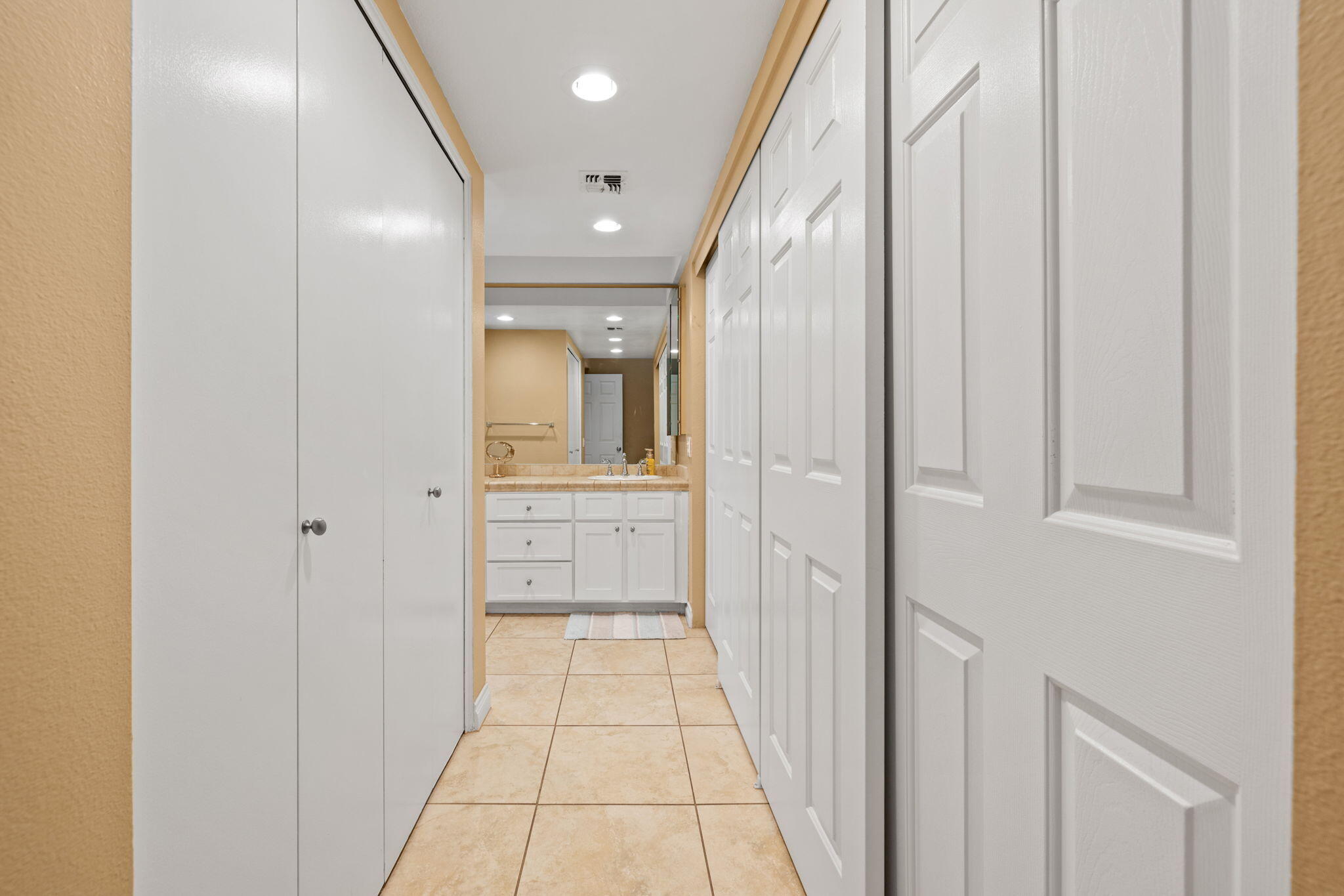 45775 Juniper Circle, Unit 616A Palm Desert, CA 92260 - Photo 21 of 35 a bathroom with a sink and a mirror