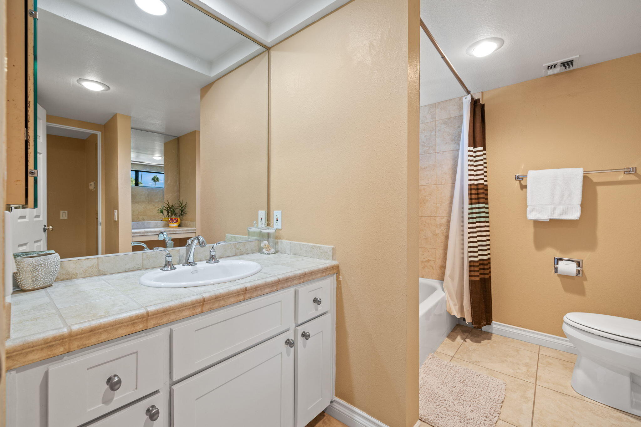 45775 Juniper Circle, Unit 616A Palm Desert, CA 92260 - Photo 26 of 35 a bathroom with a sink a toilet and shower