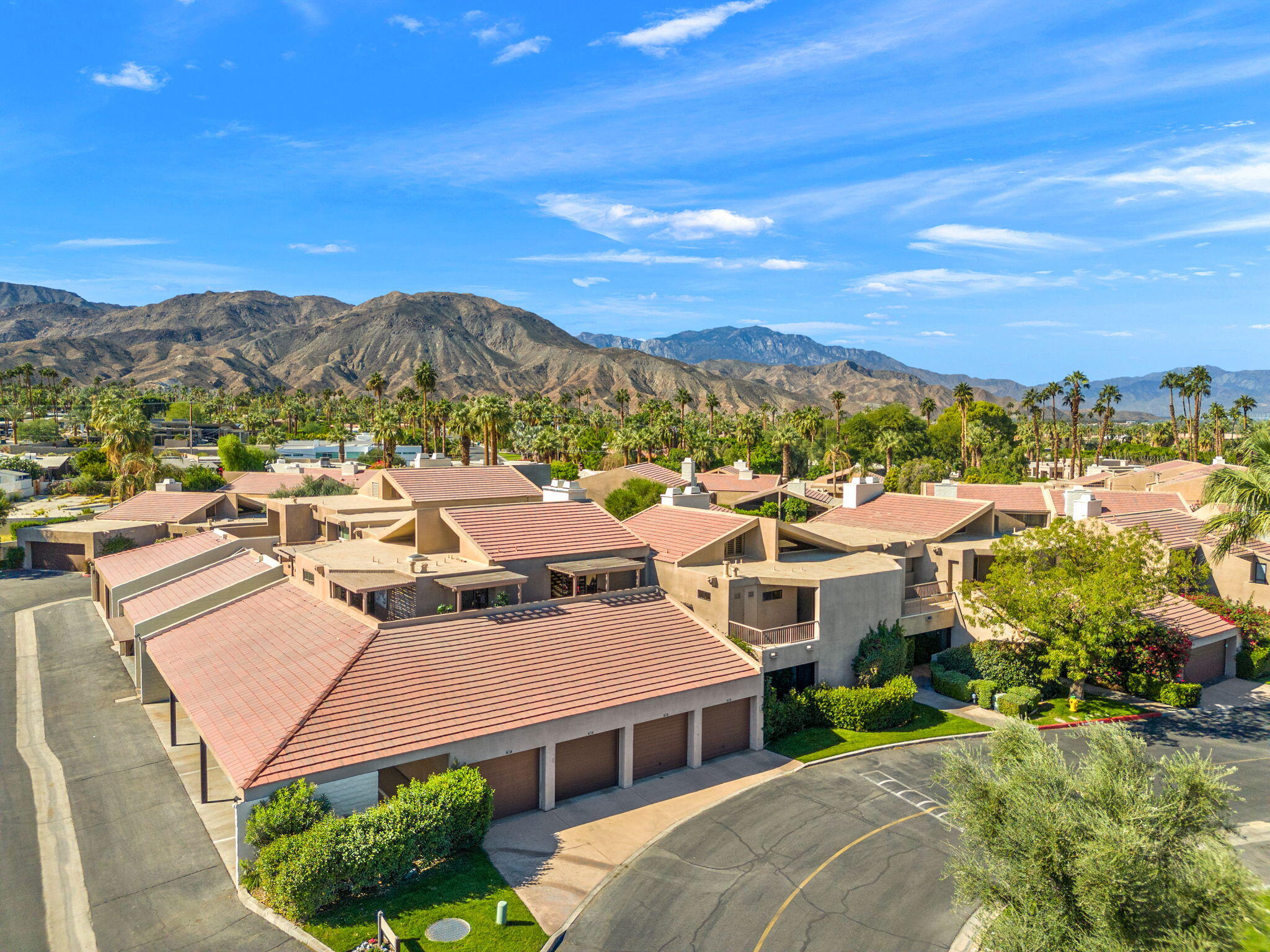 45775 Juniper Circle, Unit 616A Palm Desert, CA 92260 - Photo 28 of 35 a view of a house with a yard